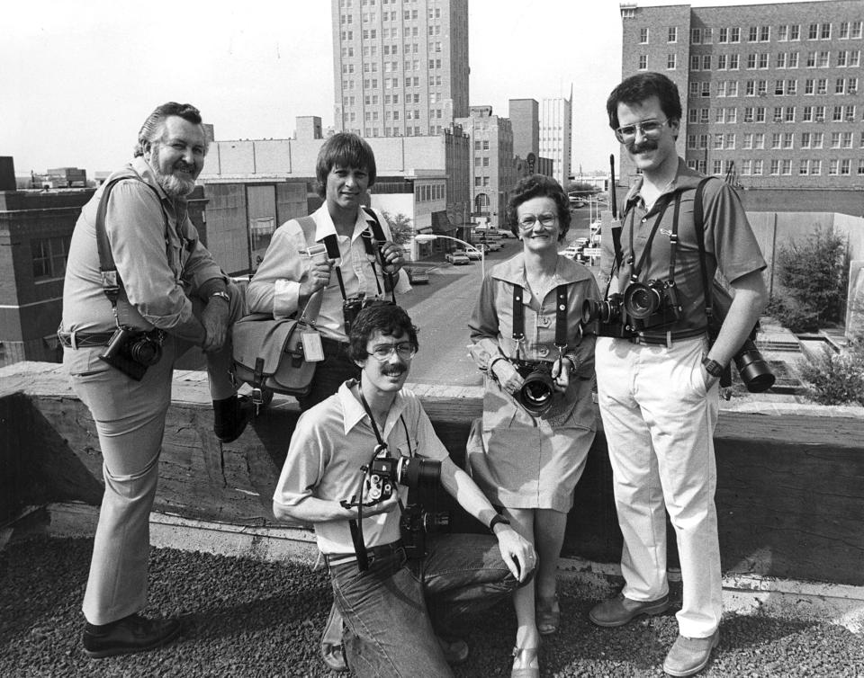 The Abilene Reporter-News photography staff in April 1981. Clockwise from upper left: Chief photographer Don Blakely, Gerald Ewing, Office Manager Virginia Lanier, David Leeson, and David Kent.