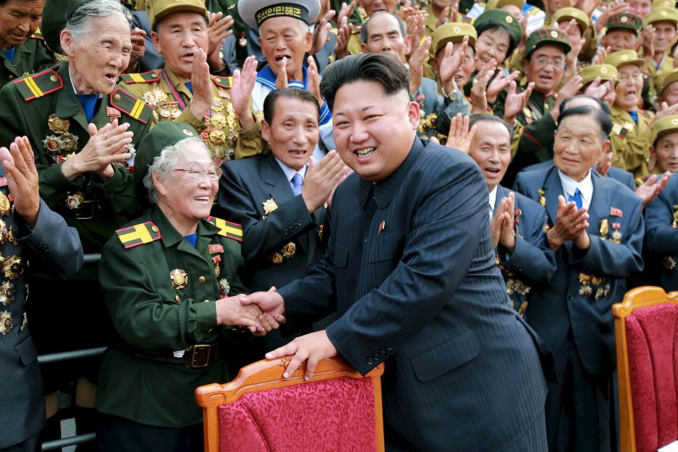 North Korean leader Kim Jong Un had a photo session with the participants in the Fourth National Conference of War Veterans in front of the Fatherland Liberation War Martyrs Cemetery in this undated photo released by North Korea's Korean Central News Agency (KCNA) on July 30, 2015. REUTERS/KCNA ATTENTION EDITORS - THIS PICTURE WAS PROVIDED BY A THIRD PARTY. REUTERS IS UNABLE TO INDEPENDENTLY VERIFY THE AUTHENTICITY, CONTENT, LOCATION OR DATE OF THIS IMAGE. FOR EDITORIAL USE ONLY. NOT FOR SALE FOR MARKETING OR ADVERTISING CAMPAIGNS. THIS PICTURE IS DISTRIBUTED EXACTLY AS RECEIVED BY REUTERS, AS A SERVICE TO CLIENTS. NO THIRD PARTY SALES. NOT FOR USE BY REUTERS THIRD PARTY DISTRIBUTORS. SOUTH KOREA OUT. NO COMMERCIAL OR EDITORIAL SALES IN SOUTH KOREA.