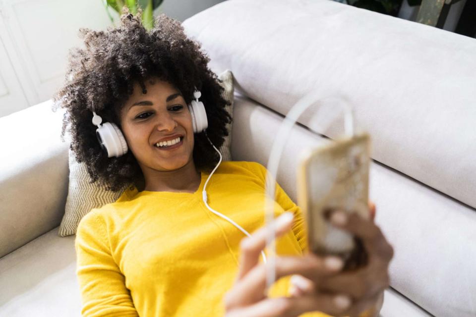 An image of a woman wearing headphones.