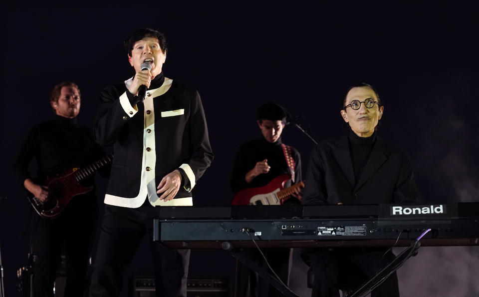 Russell Mael, second from left, and his brother Ron, far right, of the band Sparks perform before a special screening of the film “Annette” at the Hollywood Forever Cemetery, Aug. 18, 2021 - Credit: Chris Pizzello/Invision/AP