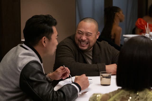 <p>Disney/Beth Dubber</p> Simu Liu and David Chang in 'Chrissy & Dave Dine Out'