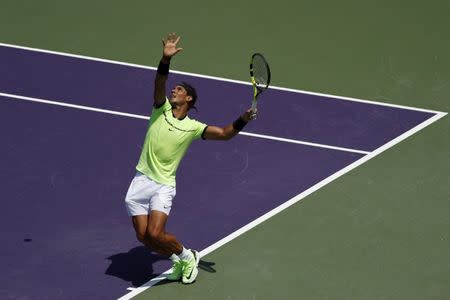 Mar 31, 2017; Miami, FL, USA; Rafael Nadal of Spain serves against Fabio Fognini of Italy (not pictured) during a men's singles semi-final in the 2017 Miami Open at Brandon Park Tennis Center. Nadal won 6-1, 7-5. Geoff Burke-USA TODAY Sports