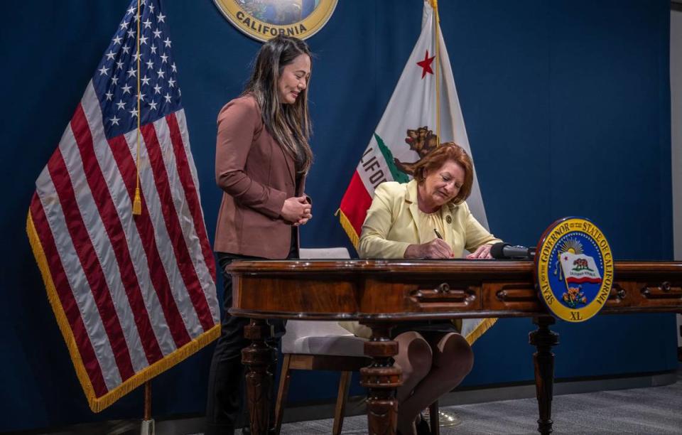 Senate President Pro Tempore Toni G. Atkins, D-San Diego, signs Assembly Bill 354 on Thursday, July 6, 2023, while she serves as acting governor while Gov. Gavin Newsom and Lt. Gov. Eleni Kounalakis are out of state. It was the first time in state history an openly LGBTQ person signed a bill into state law. SB 354, authored by Assemblywoman Stephanie Nguyen, left, allows the city of Elk Grove to assign two members to the Sacramento Regional Transit District board of directors.