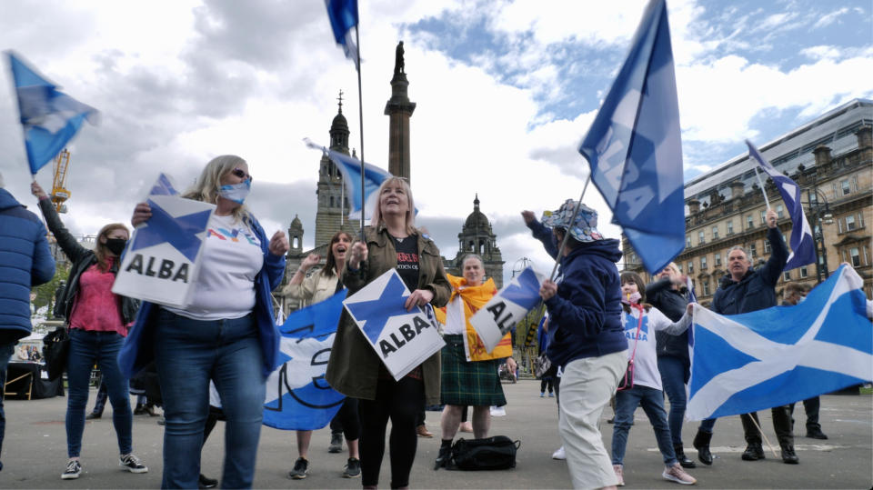 Scottish independence supporters attend a rally in Glasgow, Scotland, Saturday, May 1, 2021. Scotland holds an election Thursday that could hasten the breakup of the United Kingdom. The pro-independence Scottish National Party is leading in the polls and a big victory will give it the the moral right and the political momentum to hold a referendum on whether Scotland should end its three-century union with England. But many voters, even if they support independence, are cautious. (AP Photo/Renee Graham)