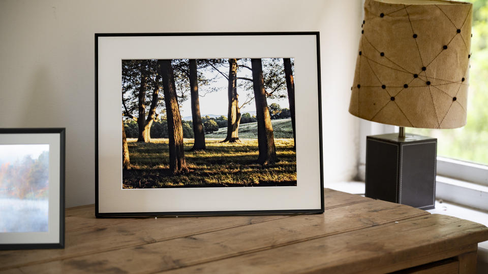 Aura Walden digital photo frame on a wooden sideboard