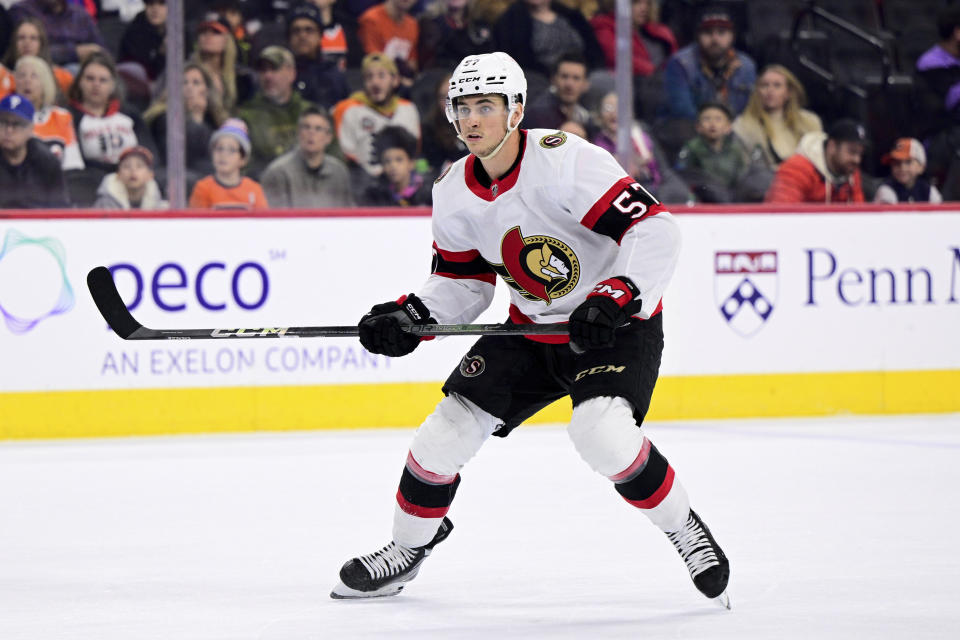 FILE - Ottawa Senators' Shane Pinto skates during the first period of an NHL hockey game against the Philadelphia Flyers, Sunday, Jan. 21, 2024, in Philadelphia. Pinto has been nearly a point-a-game player for the Ottawa Senators since returning from his half-season suspension for violating the NHL’s gambling policy. Pinto and his teammates are still eyeing a longshot run to get into the playoffs. And the 23-year-old from Long Island says he cares about wins and isn't thinking about his production. (AP Photo/Derik Hamilton, File)