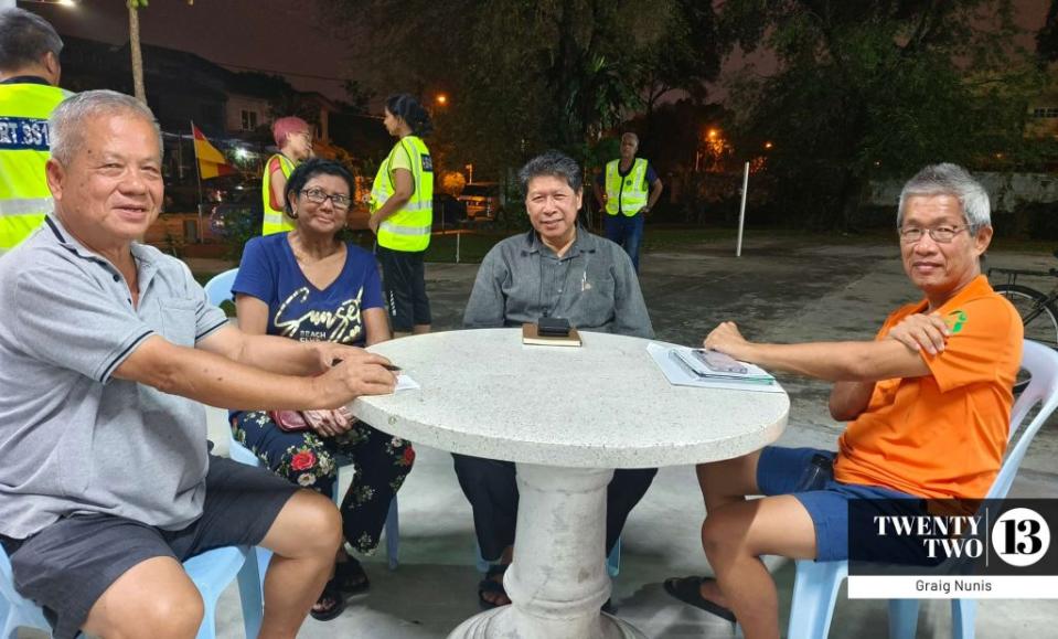 Woo (right) and several members of Concerned And Affected Residents (CAREs) Group