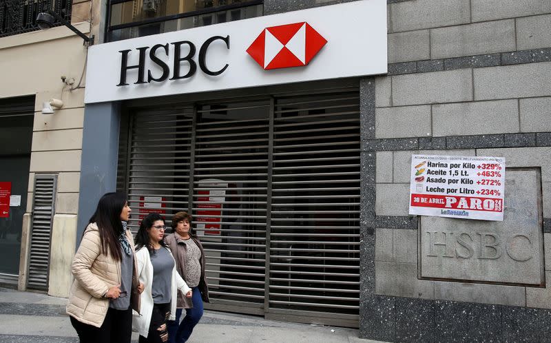 FILE PHOTO: Pedestrians walk past closed HSBC bank during a national strike in Buenos Aires