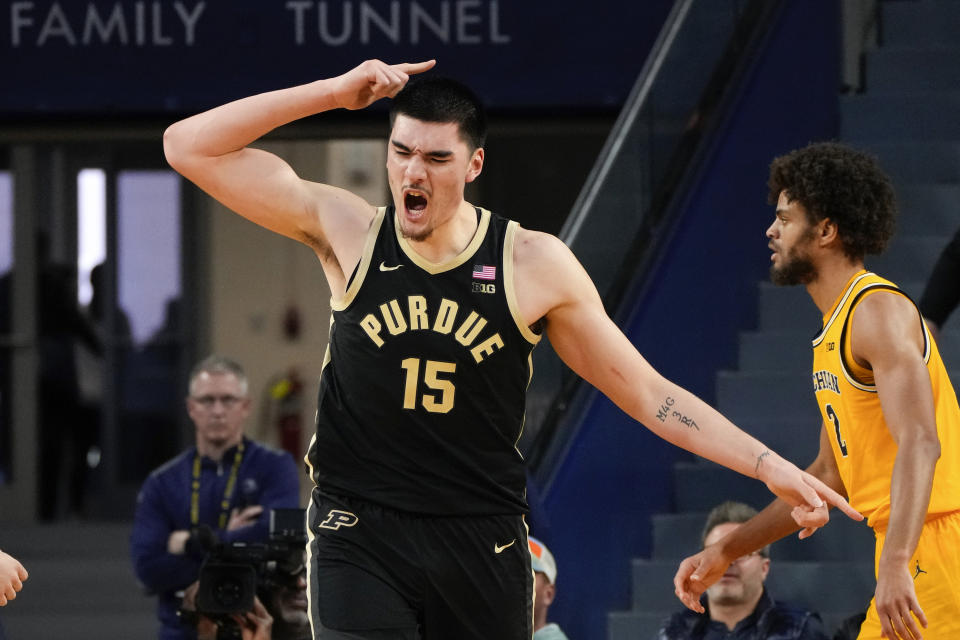 Purdue center Zach Edey (15) reacts to a basket against Michigan in the second half of an NCAA college basketball game in Ann Arbor, Mich., Sunday, Feb. 25, 2024. (AP Photo/Paul Sancya)