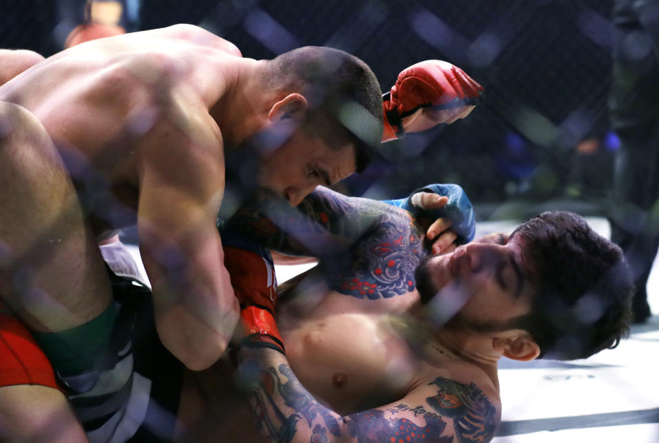 Dillon Danis, right, fights Kyle Walker in a mixed martial arts welterweight bout at Bellator 198, Saturday, April 28, 2018, in Rosemont, Ill. (AP Photo/Nam Y. Huh)