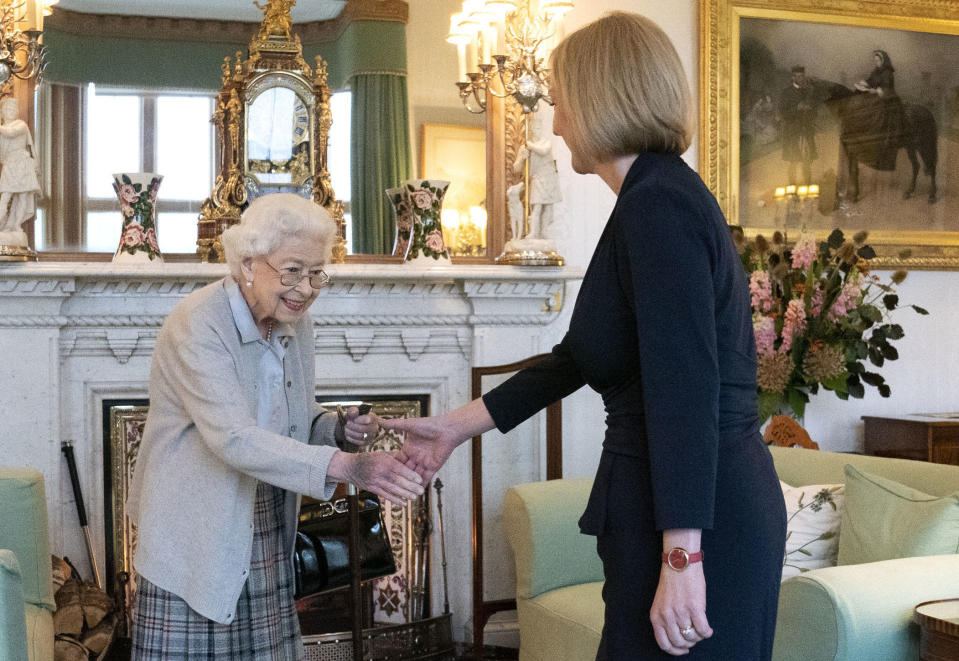 ABERDEEN, SCOTLAND - SEPTEMBER 06: Queen Elizabeth greets newly elected leader of the Conservative party Liz Truss as she arrives at Balmoral Castle for an audience where she will be invited to become Prime Minister and form a new government on September 6, 2022 in Aberdeen, Scotland. The Queen broke with the tradition of meeting the new prime minister and Buckingham Palace, after needing to remain at Balmoral Castle due to mobility issues. (Photo by Jane Barlow - WPA Pool/Getty Images)