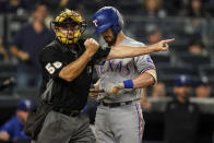 Texas Rangers' Nick Solak, right, reacts as home plate umpire Dan Iassogna, left, calls him out on strikes during the eighth inning of a baseball game against the New York Yankees, Monday, Sept. 20, 2021, in New York. (AP Photo/Frank Franklin II)
