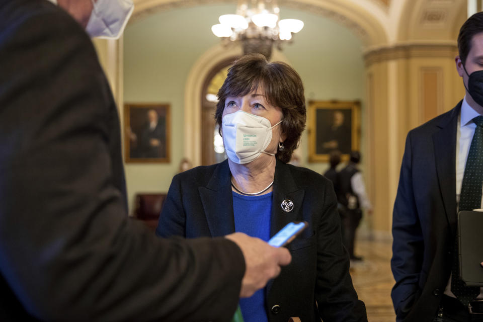 Sen. Susan Collins, R-Maine, speaks to a reporter at the Capitol in Washington, Wednesday, Jan. 19, 2022. (AP Photo/Amanda Andrade-Rhoades)