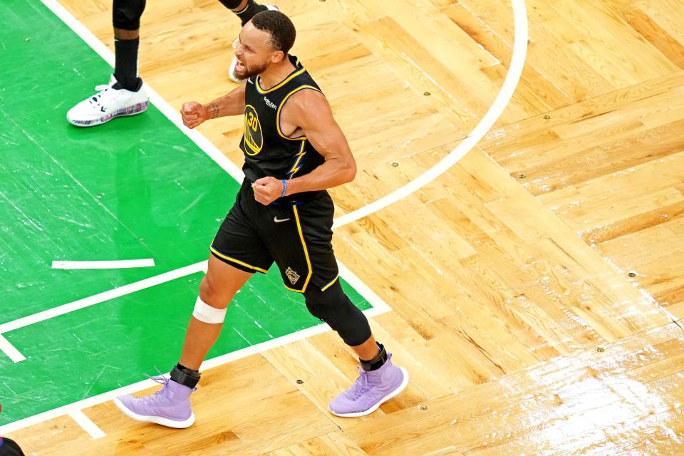 Game 4: Warriors guard Stephen Curry celebrates after beating the Celtics.