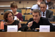 Dimitri Scarlato, right, and Monique Hawkins, left, of the 3 million attend a meeting of the Committee on Constitutional Affairs at the European Parliament in Brussels, Tuesday, Oct. 8, 2019. The committee meeting was held to discuss citizen rights of UK citizens living in the EU and EU citizens living in the UK. (AP Photo/Virginia Mayo)