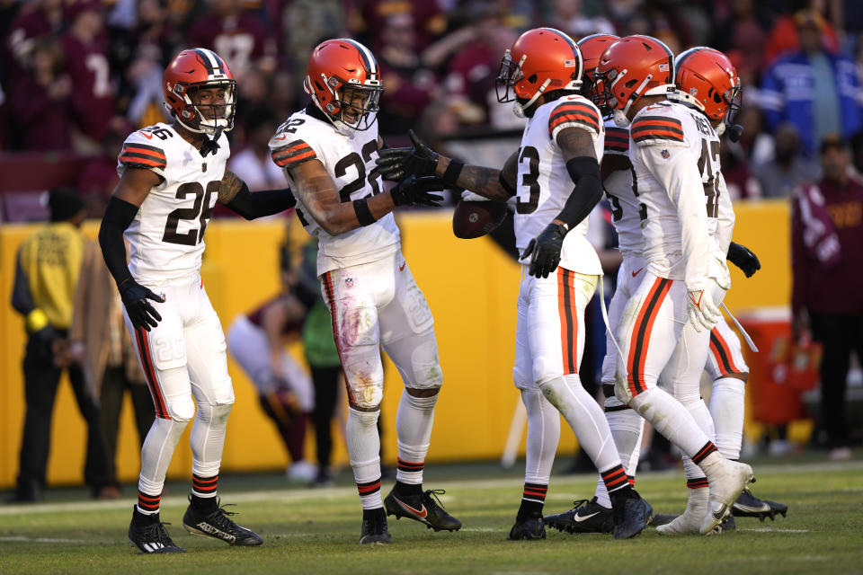 Cleveland Browns safety Grant Delpit (22) celebrates an interception with teammates during the second half of an NFL football game against the Washington Commanders, Sunday, Jan. 1, 2023, in Landover, Md. (AP Photo/Susan Walsh)