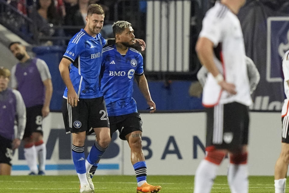 CF Montréal defender Gabriele Corbo, front left, puts his arm around teammate midfielder Josef Martinez after Martinez scored during the second half of an MLS soccer match against FC Dallas, Saturday, March 2, 2024, in Frisco, Texas. (AP Photo/LM Otero)