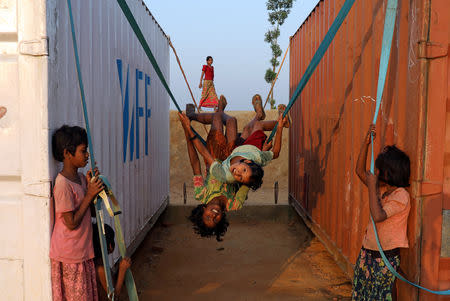 Rohingya refugee children play with a swing at Balukhali camp in Cox’s Bazar, Bangladesh, November 16, 2018. REUTERS/Mohammad Ponir Hossain/File Photo