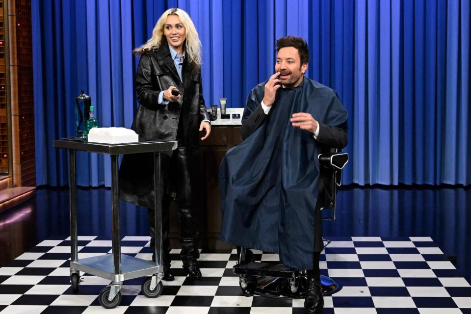 THE TONIGHT SHOW STARRING JIMMY FALLON -- Episode 1763 -- Pictured: (l-r) Singer-songwriter Miley Cyrus shaves host Jimmy Fallons beard on Friday, December 9, 2022 -- (Photo by: Todd Owyoung/NBC via Getty Images)