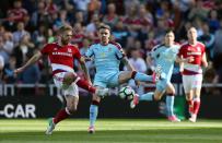 <p>Middlesbrough’s Adam Clayton (left) and Burnley’s Robbie Brady battle for the ball</p>