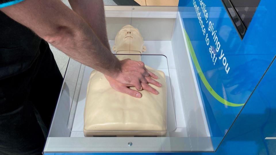Hands on a mannequin on the CPR machine