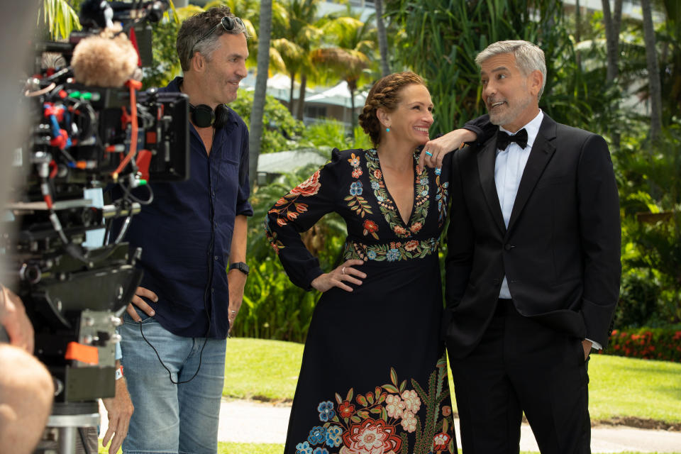 (from left) Director Ol Parker, Julia Roberts and George Clooney on the set of Ticket to Paradise. (Universal Pictures)