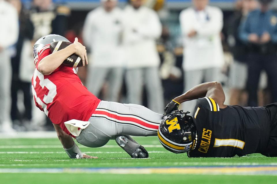 Ohio State quarterback Devin Brown (33) injured his ankle during Ohio State's 14-3 loss to Missouri in the Cotton Bowl.