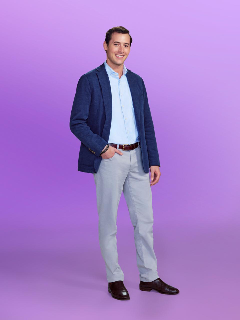 Drake, a candidate at "Love is blind" Season 6, wearing a blue jacket and grey pants