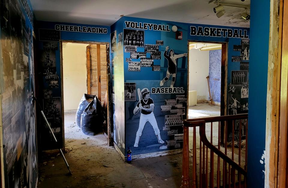 Imagery celebrating Marysville sports covers the walls of the second story on Friday, May 26, 2023, mid-demolition of the interior of the old Marysville Historical Museum building on Huron Boulevard. It is being remodeled into a short-term, Airbnb-type structure.