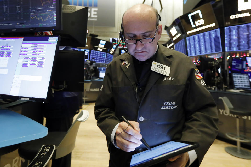 Trader Andrew Silverman works on the floor of the New York Stock Exchange, Wednesday, Dec. 11, 2019. Stocks are opening mixed on Wall Street following news reports that US President Donald Trump might delay a tariff hike on Chinese goods set to go into effect this weekend. (AP Photo/Richard Drew)