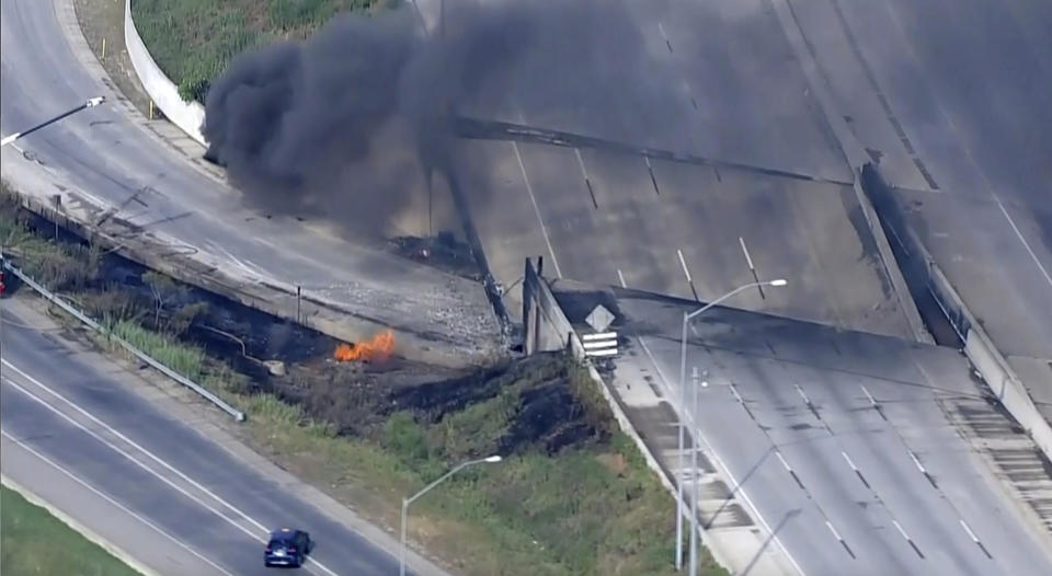 This screen grab from video provided by WPVI-TV/6ABC shows fire and smoke near the collapsed section of I-95 in Philadelphia, Sunday, June 11, 2023. (WPVI-TV/6ABC via AP)