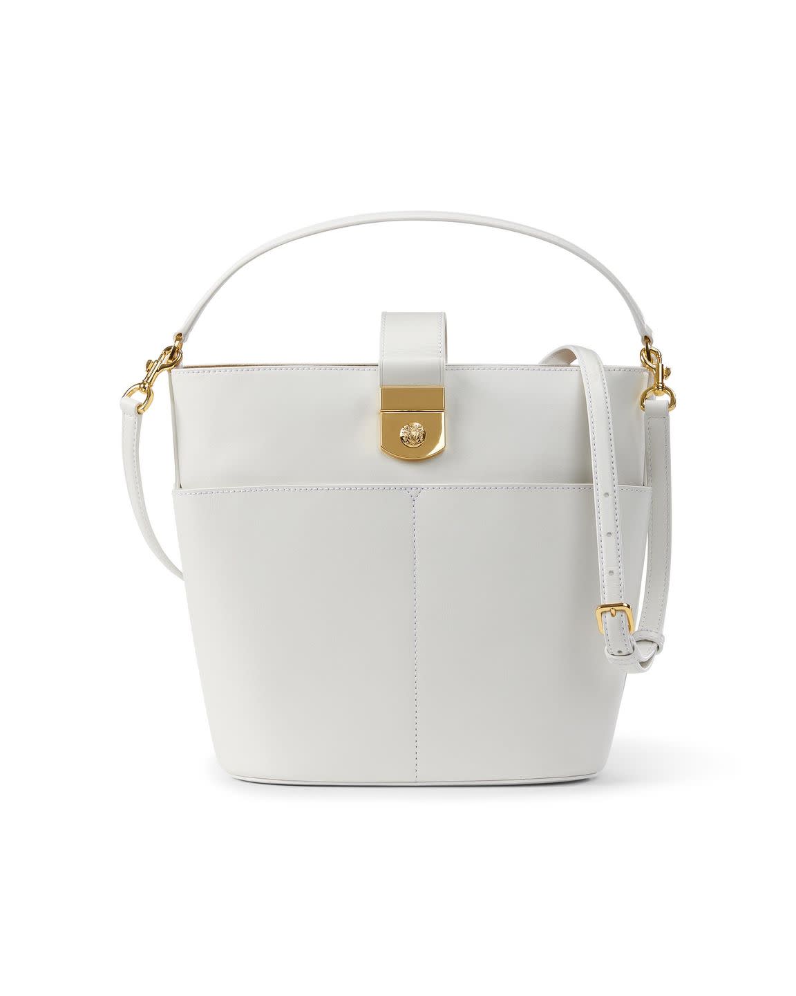 a white handbag with a gold ring