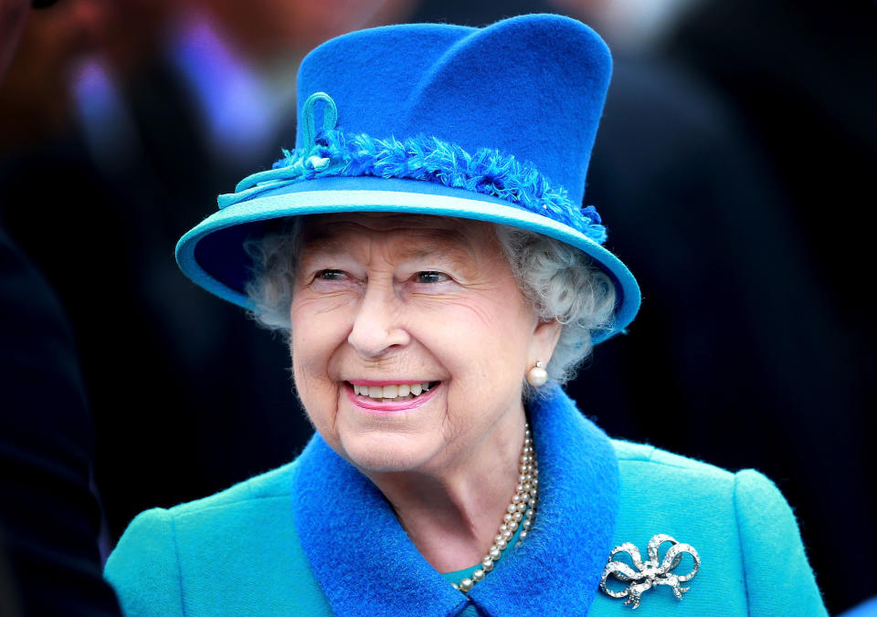 Queen Elizabeth in 2015 dressed in a blue suit and hat