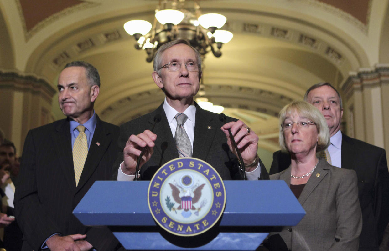 Then-Senate Majority Leader Harry Reid of Nev., center, speaks on Capitol Hill in Washington on Aug. 2, 2011. From left are, Sen. Charles Schumer, D-N.Y., Reid, Sen. Patty Murray, D-Wash., and Senate Majority Whip Richard Durbin of Ill. (AP Photo/J. Scott Applewhite)