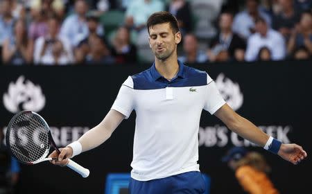 Tennis - Australian Open - Rod Laver Arena, Melbourne, Australia, January 22, 2018. Novak Djokovic of Serbia reacts during his match against Chung Hyeon of South Korea. REUTERS/Issei Kato