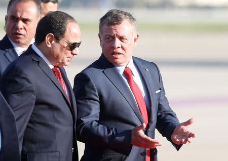 Jordan's King Abdullah II welcomes Egypt's President Abdel Fattah al-Sisi during a reception ceremony at the Queen Alia International Airport in Amman, Jordan March 28, 2017. REUTERS/Muhammad Hamed