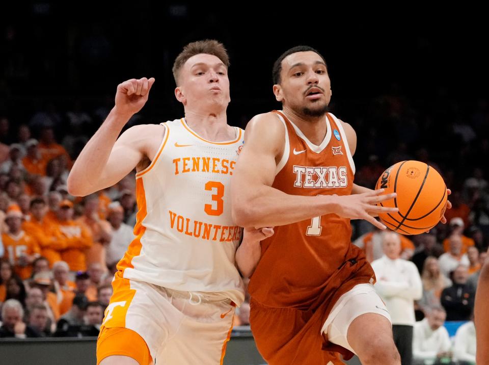 Texas forward Dylan Disu, right, drives past Tennessee guard Dalton Knecht in the second round of the NCAA Tournament on Saturday at Spectrum Center in Charlotte, N.C. After Texas' 62-58 loss, Disu reflected on his development into an All-Big 12 player and the best single-season 3-point shooter in school history.