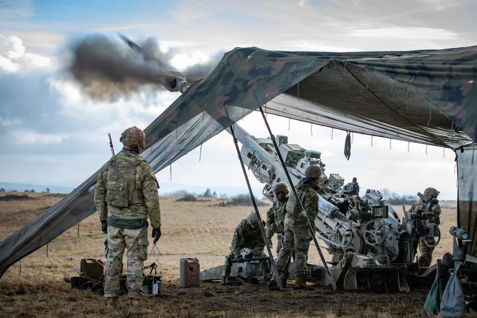 US soldiers fire a M777 towed 155 mm howitzer during an exercise at Vilseck, Germany on Feb. 13, 2024.
