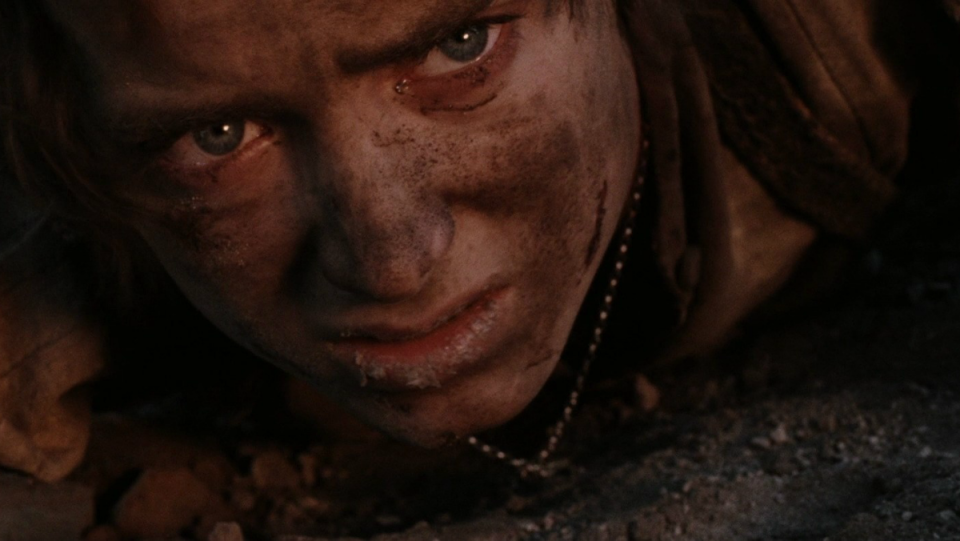 Frodo climbs Mount Doom in a scene from Lord of the Rings: Return of the King.