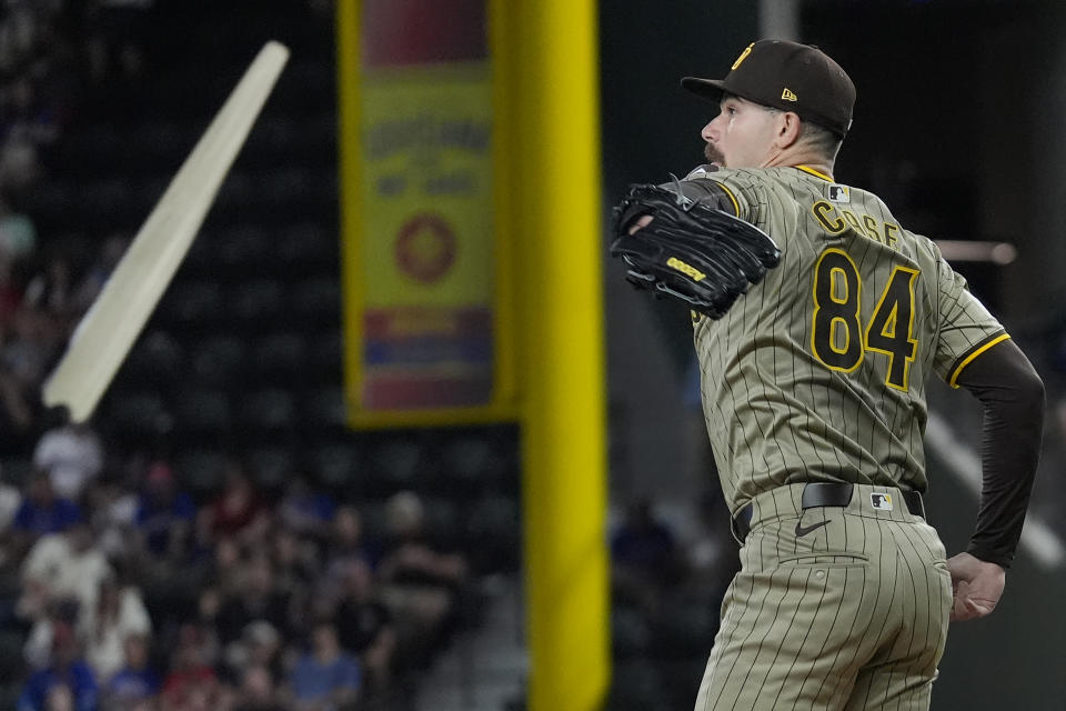 A broken bat flies past San Diego Padres starting pitcher Dylan Cease (84) during the second inning of a baseball game against the Texas Rangers in Arlington, Texas, Tuesday, July 2, 2024. (AP Photo/LM Otero)