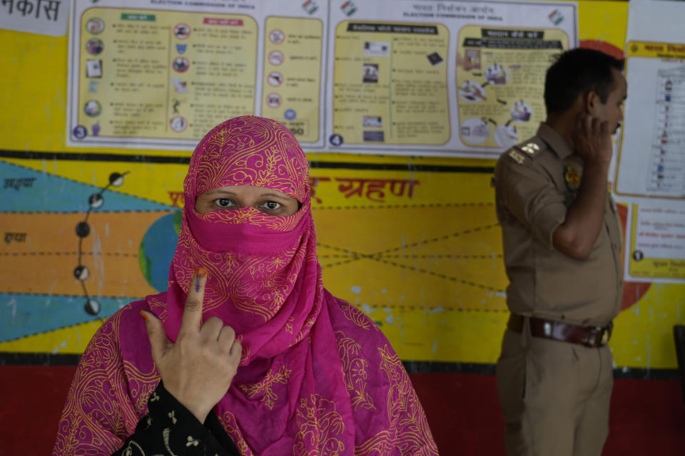 A women displays indelible ink mark on her finger after casting her vote during the fifth phase of general election, in Ayodhya , India, Monday, May 20, 2024. The seven phase staggered election will run until June 1 before votes are counted on June 4. Almost 970 million voters will cast their ballots in this election, more than 10% of the world’s population. (AP Photo/Rajesh Kumar Singh)