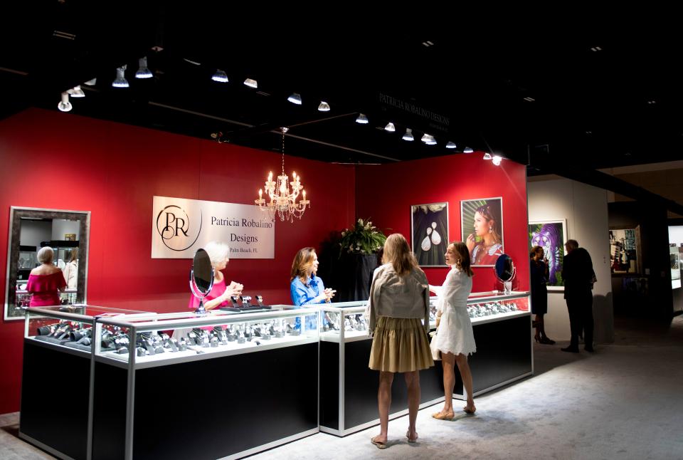 Patricia Robalino Design, of Palm Beach, has a display of jewelry during the Feb. 17, 2023 opening night of the 20th Palm Beach Show at the Palm Beach County Convention Center.