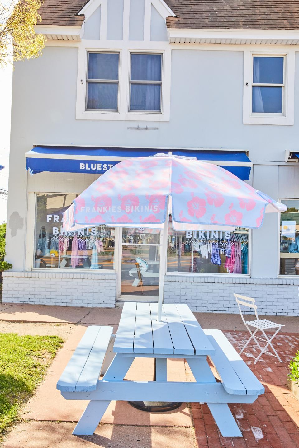 Outside of Bluestone Lane Coffee’s Montauk coffee shop, which includes a space carved out for Frankies Bikinis merchandise. - Credit: Courtesy Photo