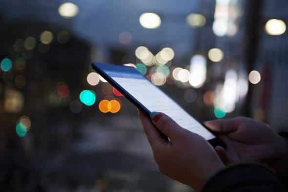 a woman using a digital tablet