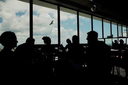 Participants chat at the rooftop of a hotel before the beginning of the Caribbean qualifying round for the Tango World Championship in Buenos Aires, in Havana