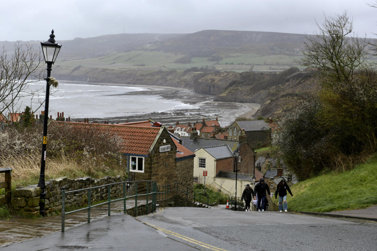 Robin Hood's Bay, the fishing village on the North York Moors, is home to a very small number of people - but residents say they are now outnumbered '70-30' by second home owners. (Reach)