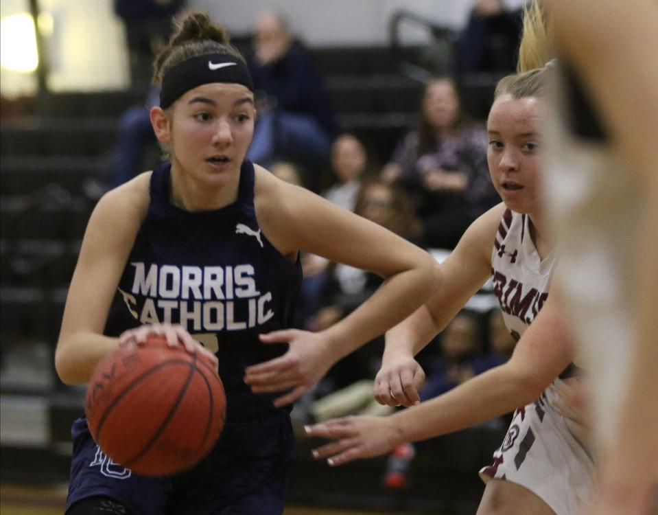 Natalie Stoupakis of Morris Catholic takes the ball in the offensive zone in the first half as Morristown Beard topped Morris Catholic 51-46.