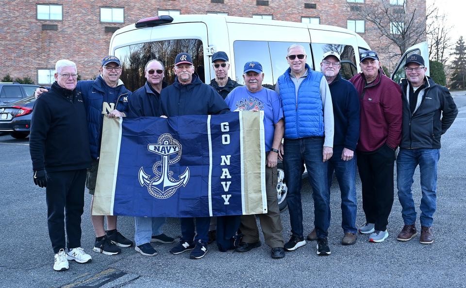 Dave Tupper, Bob Croatti, Jim Gable, Bob Sannicandro, Bob Smith, Dan Gower, Bert Bowman, Chris Lynch, Jack Trabucco,and Brian McCann, a group of high school friends from MetroWest High School, gather at the Sheraton Framingham Hotel before heading off the the Army/Navy football game, Dec. 9, 2022.    Most of the group are Marian High School graduates.  