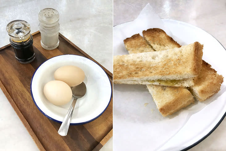 Half-boiled eggs and 'roti bakar'