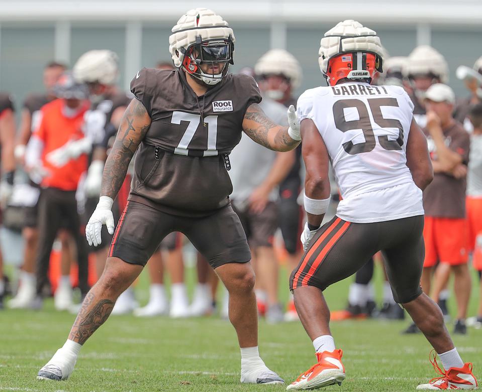 Cleveland Browns left tackle Jedrick Wills Jr. has the task of blocking defensive end Myles Garrett during training camp on Aug. 5, 2022, in Berea.